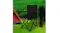 Black camping chair set up next to a folded chair outdoors, positioned on grass beside a tent and green hedge Black camping chair set up next to a folded chair outdoors, positioned on grass beside a tent and green hedge