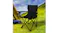 Black Levede folding camping chair beside a tent in a grassy field, with hills and sky in the background Black Levede folding camping chair beside a tent in a grassy field, with hills and sky in the background