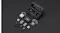 DJI Mic Mini 2 components arranged on a dark surface, including transmitters, receivers, clips, and cables DJI Mic Mini 2 components arranged on a dark surface, including transmitters, receivers, clips, and cables