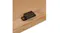 Close-up of a magnetic cabinet latch installed on a wooden panel Close-up of a magnetic cabinet latch installed on a wooden panel