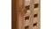 Detailed view of a wooden cabinet knob on a door panel Detailed view of a wooden cabinet knob on a door panel