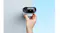 Hand adjusting a white security camera mounted on a light grey wall Hand adjusting a white security camera mounted on a light grey wall