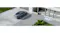 High-angle view of a grey car in a driveway with a 180-degree text overlay High-angle view of a grey car in a driveway with a 180-degree text overlay