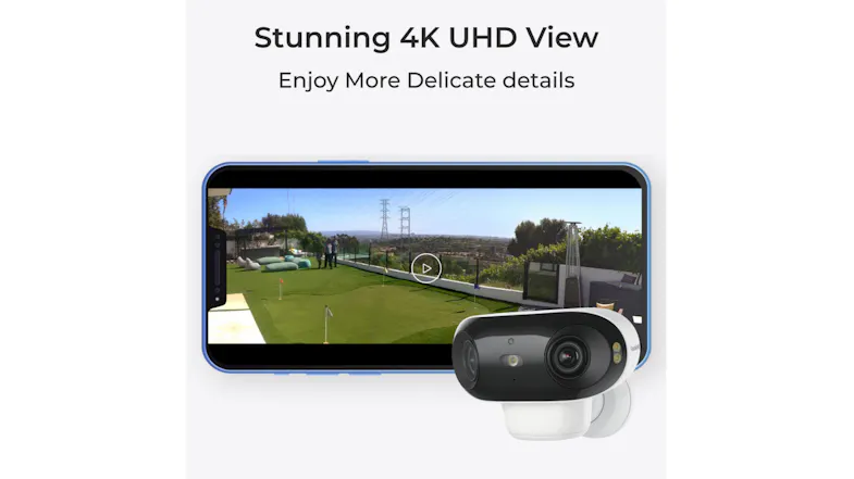 Smartphone displaying a wide backyard view from the security camera Smartphone displaying a wide backyard view from the security camera