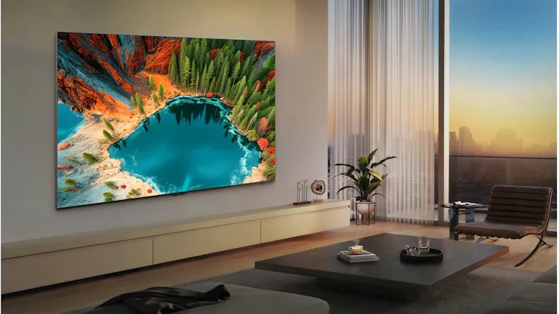 Evening lifestyle image of the TV mounted in a living room, displaying a colourful landscape scene Evening lifestyle image of the TV mounted in a living room, displaying a colourful landscape scene