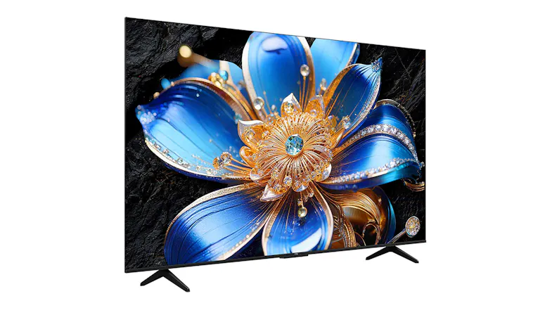 Three‑quarter angled left view of the TCL TV, showing angled stand feet, and detailed QLED colour on screen Three‑quarter angled left view of the TCL TV, showing angled stand feet, and detailed QLED colour on screen