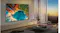 Evening lifestyle image of the TV mounted in a living room, displaying a colourful landscape scene Evening lifestyle image of the TV mounted in a living room, displaying a colourful landscape scene