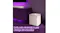 Lifestyle image of the white subwoofer next to a media cabinet and soundbar, with purple lighting Lifestyle image of the white subwoofer next to a media cabinet and soundbar, with purple lighting