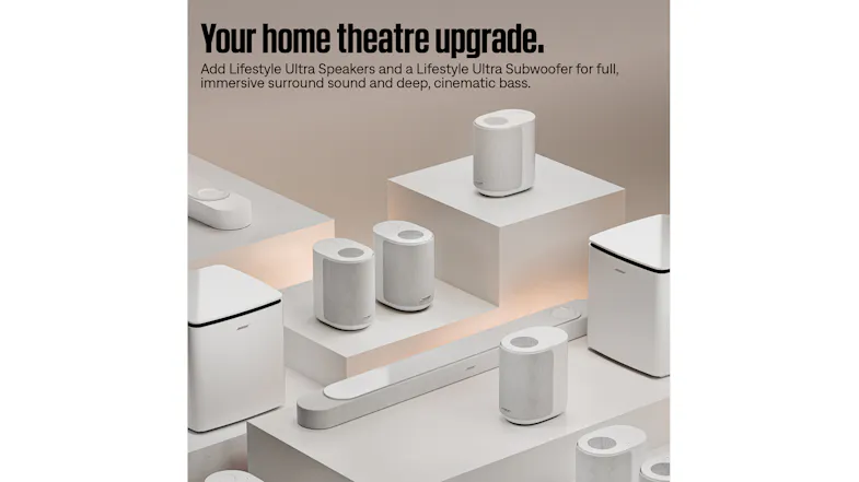 Promotional image titled “Your home theatre upgrade,” showing the white subwoofer Promotional image titled “Your home theatre upgrade,” showing the white subwoofer