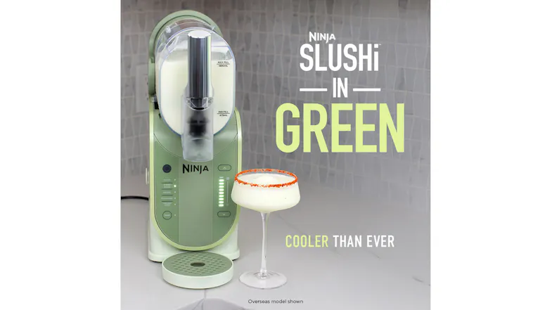 Front view of the green SLUSHi machine next to a pale margarita‑style frozen drink in a stemmed glass Front view of the green SLUSHi machine next to a pale margarita‑style frozen drink in a stemmed glass