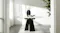 Oval dining table displayed alone, featuring a light-toned surface and bold black pedestal base Oval dining table displayed alone, featuring a light-toned surface and bold black pedestal base