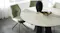 Close-up of the table in extended position, showing the central leaf seam and smooth oval shape Close-up of the table in extended position, showing the central leaf seam and smooth oval shape