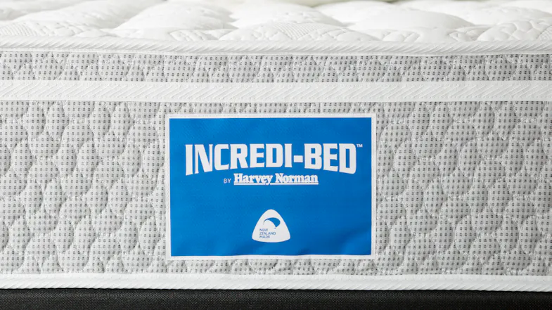A side detail of the Incredi‑Bed mattress showing the blue Incredi‑Bed by Harvey Norman logo label and woven fabric construction A side detail of the Incredi‑Bed mattress showing the blue Incredi‑Bed by Harvey Norman logo label and woven fabric construction