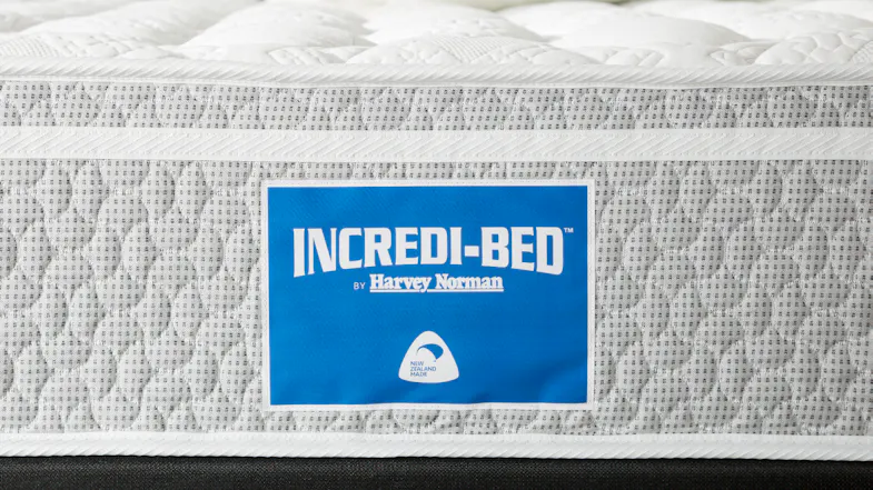 A side detail of the Incredi‑Bed mattress showing the blue Incredi‑Bed by Harvey Norman logo label and woven fabric construction A side detail of the Incredi‑Bed mattress showing the blue Incredi‑Bed by Harvey Norman logo label and woven fabric construction