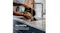 Hands rinsing the removable SimpliServe pot under a kitchen tap Hands rinsing the removable SimpliServe pot under a kitchen tap