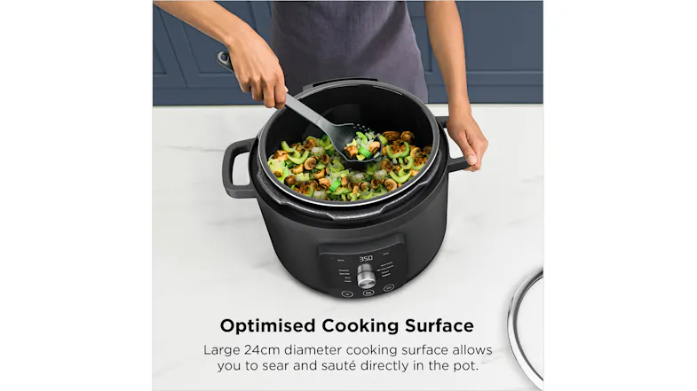 Vegetables being stirred directly inside the cooker’s inner pot using a spatula Vegetables being stirred directly inside the cooker’s inner pot using a spatula