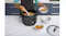 Rice and grains are scooped from the cooker into bowls on a kitchen bench Rice and grains are scooped from the cooker into bowls on a kitchen bench