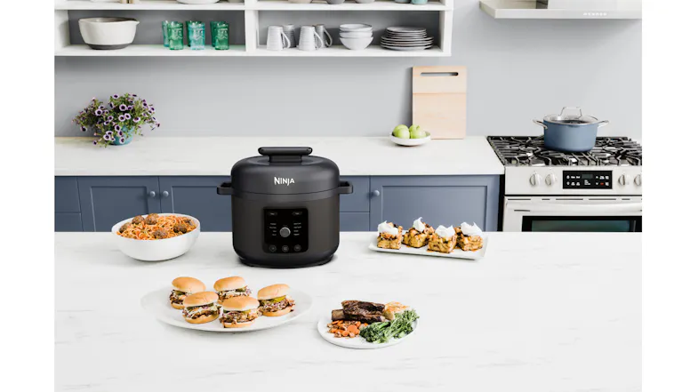The Ninja HyperHeat pressure cooker is centred on a light kitchen benchtop with the lid closed The Ninja HyperHeat pressure cooker is centred on a light kitchen benchtop with the lid closed