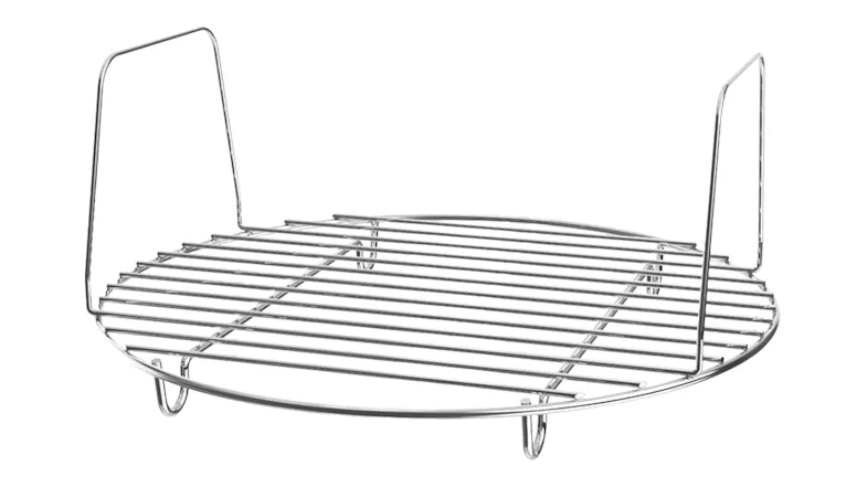 Close‑up of the metal steam rack accessory. The circular rack has raised supports and a wire construction Close‑up of the metal steam rack accessory. The circular rack has raised supports and a wire construction
