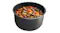 The inner pot is filled with a cooked stew containing meat, potatoes, carrots, and herbs The inner pot is filled with a cooked stew containing meat, potatoes, carrots, and herbs