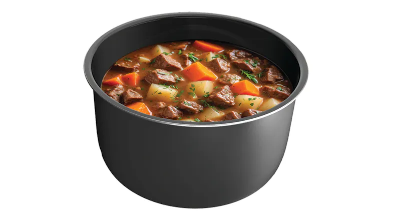 The inner pot is filled with a cooked stew containing meat, potatoes, carrots, and herbs The inner pot is filled with a cooked stew containing meat, potatoes, carrots, and herbs