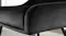 Close-up of a black dining chair showing soft fabric upholstery, curved backrest, neat stitching, and slim legs Close-up of a black dining chair showing soft fabric upholstery, curved backrest, neat stitching, and slim legs