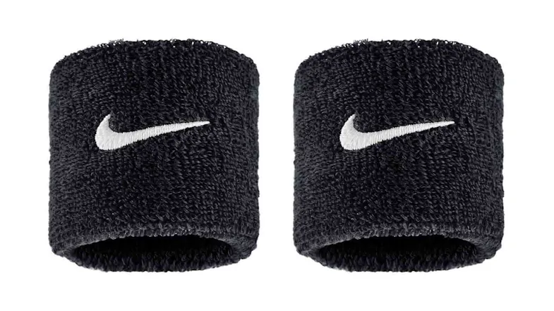 A pair of black Nike wristbands with white Swoosh logo A pair of black Nike wristbands with white Swoosh logo