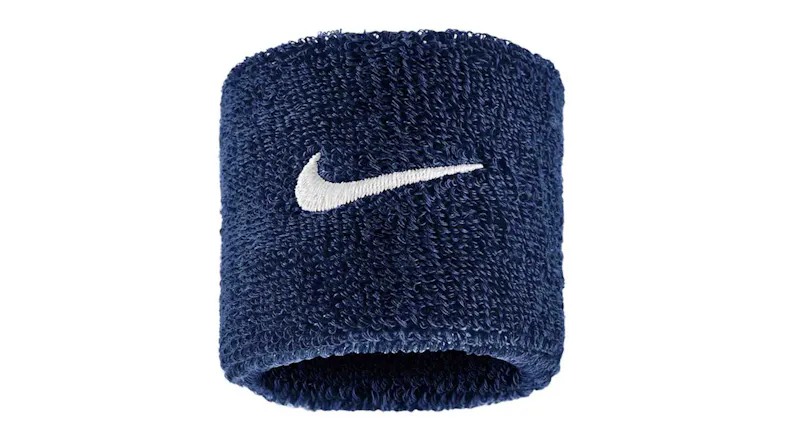 Single navy blue Nike sweatband featuring an embroidered white logo Single navy blue Nike sweatband featuring an embroidered white logo