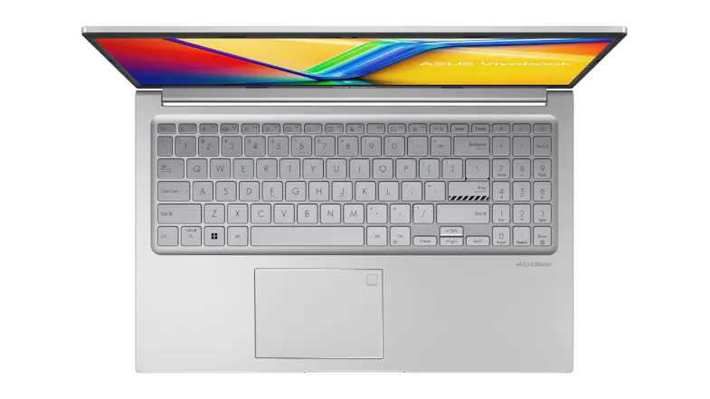 Top view of the ASUS Vivobook keyboard and touchpad, with the screen slightly visible Top view of the ASUS Vivobook keyboard and touchpad, with the screen slightly visible