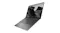 Angled view of an open grey ASUS Zenbook laptop featuring a black‑and‑white rock landscape on the screen Angled view of an open grey ASUS Zenbook laptop featuring a black‑and‑white rock landscape on the screen