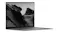 Low-angle side view of ASUS Zenbook open, emphasising the thin base and wide display Low-angle side view of ASUS Zenbook open, emphasising the thin base and wide display