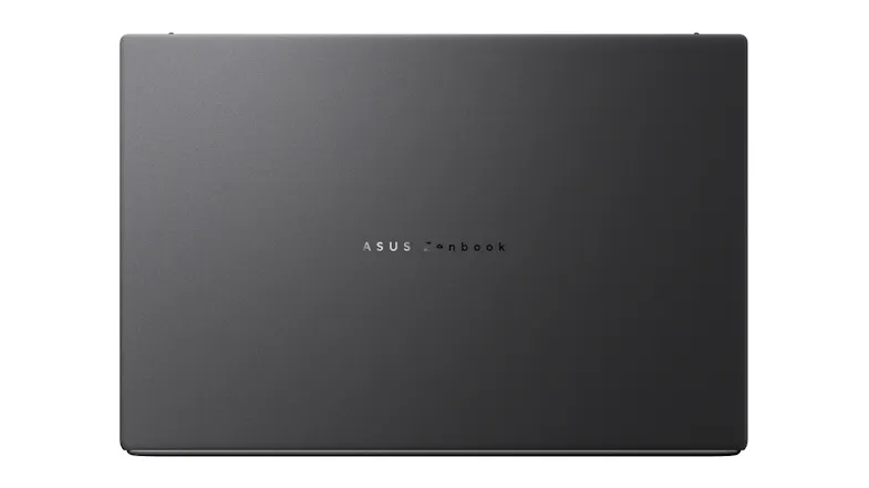 Closed ASUS Zenbook laptop with a dark grey matte finish, viewed straight from above Closed ASUS Zenbook laptop with a dark grey matte finish, viewed straight from above