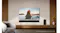 Modern living room featuring a wall-mounted TV above a soundbar Modern living room featuring a wall-mounted TV above a soundbar