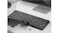 Handheld vacuum cleaning crumbs from the computer keyboard with a brush attachment for delicate surface cleaning Handheld vacuum cleaning crumbs from the computer keyboard with a brush attachment for delicate surface cleaning