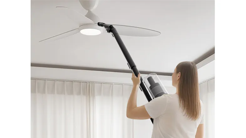 Cordless stick vacuum with extension wand, cleaning ceiling fan blades for easy high-reach dust removal Cordless stick vacuum with extension wand, cleaning ceiling fan blades for easy high-reach dust removal