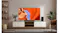 A bright living room with a TV showing green mountains and mist, flanked by speakers and indoor plants A bright living room with a TV showing green mountains and mist, flanked by speakers and indoor plants