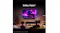 A couple in a living room with Dolby Vision content on screen A couple in a living room with Dolby Vision content on screen