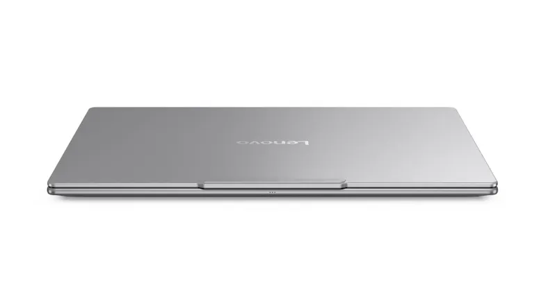 Closed Lenovo Yoga laptop with a smooth metallic finish and a slim portable form factor Closed Lenovo Yoga laptop with a smooth metallic finish and a slim portable form factor