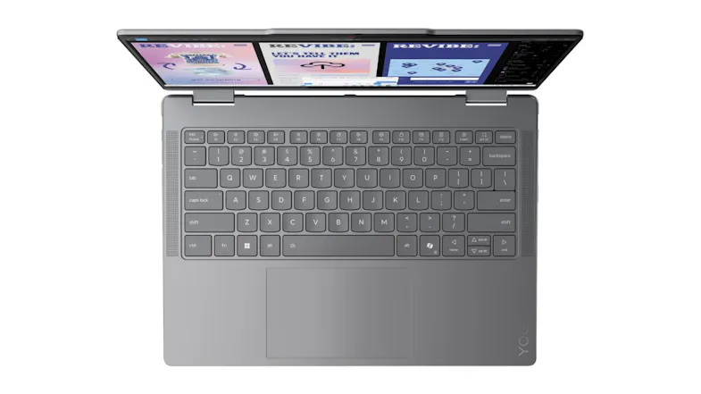 Overhead view of a modern Lenovo Yoga 7 laptop keyboard with a large trackpad and UI design screens Overhead view of a modern Lenovo Yoga 7 laptop keyboard with a large trackpad and UI design screens