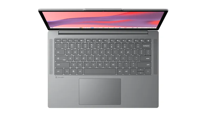 Overhead view of a grey Chromebook laptop with a chiclet keyboard, a wide touchpad, and speaker grills on both sides Overhead view of a grey Chromebook laptop with a chiclet keyboard, a wide touchpad, and speaker grills on both sides