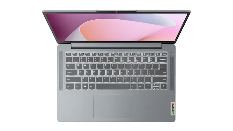 Overhead view of the Lenovo grey notebook with a compact keyboard layout and built-in speakers Overhead view of the Lenovo grey notebook with a compact keyboard layout and built-in speakers
