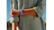 A close-up of a wrist wearing a blue fabric Fitbit Air fitness band, paired with a rolled-sleeve shirt against a soft outdoor backdrop A close-up of a wrist wearing a blue fabric Fitbit Air fitness band, paired with a rolled-sleeve shirt against a soft outdoor backdrop