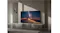 Samsung smart TV on a low stand showing the Milky Way over desert dunes in a contemporary interior setting Samsung smart TV on a low stand showing the Milky Way over desert dunes in a contemporary interior setting