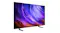 Angled view of the Samsung OLED television emphasising the thin frame, wide screen, and minimalist stand Angled view of the Samsung OLED television emphasising the thin frame, wide screen, and minimalist stand