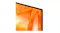 Close-up of the TV corner, highlighting the thin black bezel and orange abstract display detail Close-up of the TV corner, highlighting the thin black bezel and orange abstract display detail