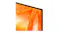 Close-up of the TV corner, highlighting the thin black bezel and orange abstract display detail Close-up of the TV corner, highlighting the thin black bezel and orange abstract display detail