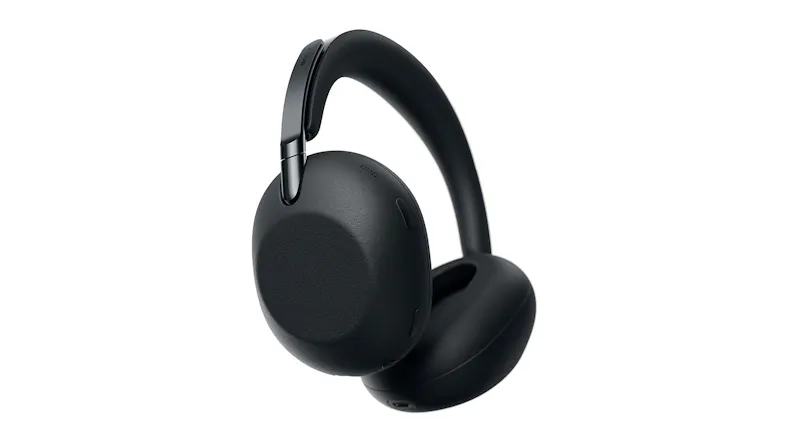 Left angled down view of a pair of black over‑ear headphones showing earcup and USB‑C charging port Left angled down view of a pair of black over‑ear headphones showing earcup and USB‑C charging port