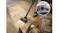 A cordless vacuum-cleaning cereal mess on a wood floor with a diagram inset showing brush roll airflow and suction technology A cordless vacuum-cleaning cereal mess on a wood floor with a diagram inset showing brush roll airflow and suction technology