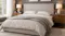 Contemporary bed with upholstered headboard, soft duvet, side tables, and warm ambient lighting Contemporary bed with upholstered headboard, soft duvet, side tables, and warm ambient lighting