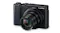 Front view of a Panasonic Lumix camera with a fully extended Leica zoom lens against a neutral backdrop Front view of a Panasonic Lumix camera with a fully extended Leica zoom lens against a neutral backdrop